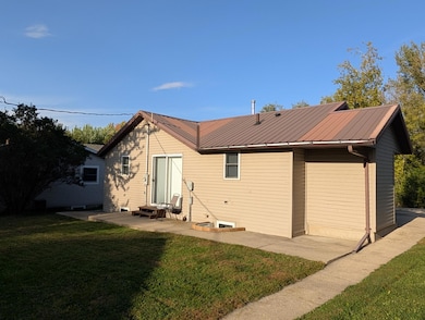 Back side of home features sliding door to patio areas.