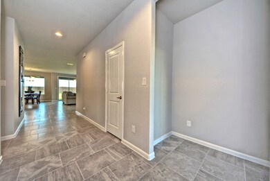 Welcome Home!  Stunning Large Tile Floors are through the home with Lush Carpeting in all of the bedrooms!