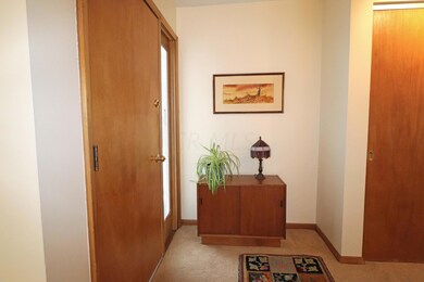 Foyer with double door closet