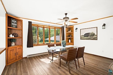 Dining room with hardwood / wood-style flooring an