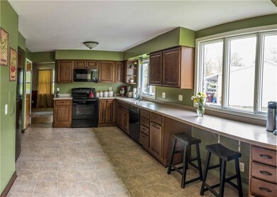 Corian countertops, breakfast bar looking out to t