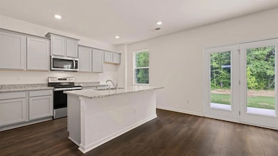 Kitchen featuring stainless steel appliances, a we