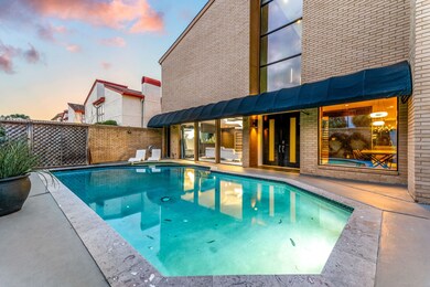 Stylish pool area with a spacious patio, large win