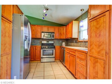 Remodeled kitchen with ceramic tile floors and new