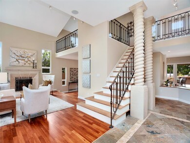 Elegant living room is flooded with light and feat
