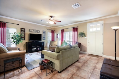 Living room with baseboards, visible vents, ceili