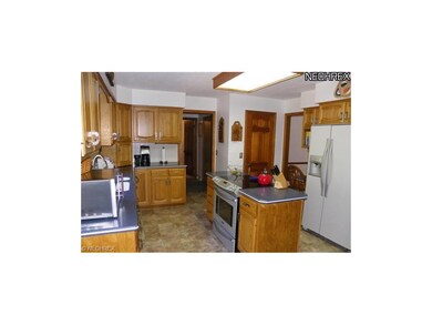 Another view of fully applianced kitchen
