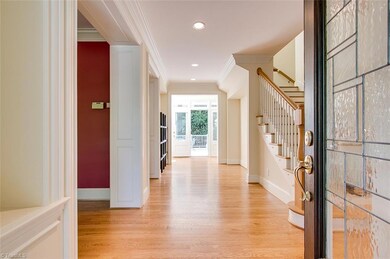 Entry foyer showcasing the beautiful view from front to back of the home and the gorgeous door.
