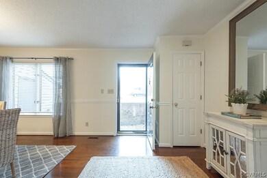 Hardwood floors, crown and chair rail distinguish