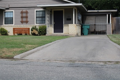View of front of home with brick siding and a porch