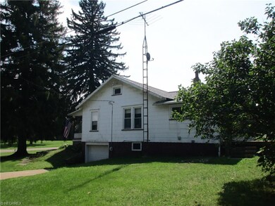 One car garage with paved drive