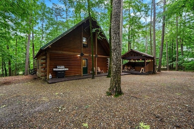 View of property exterior with log siding