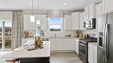 (Photo of decorated model, colors and features will vary)  Another view of this spacious kitchen!