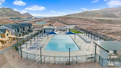 Community pool with a patio area and a mountain view