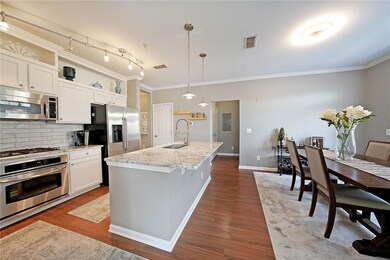 Kitchen featuring visible vents, dark wood finishe