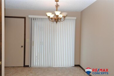 The dining room connects the living room and the kitchen with the big back yard.