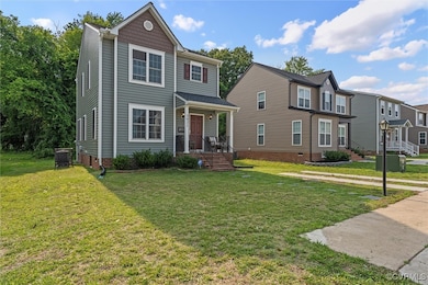 View of front of home featuring a front yard and c