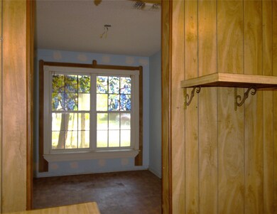 Stepping out of the kitchen is the dining room.