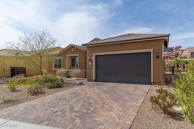 View of front of house featuring decorative drivew