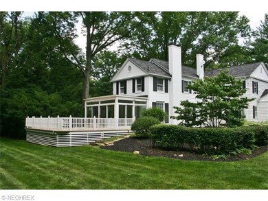 A large Deck off a wonderful Sunroom overlooks bea