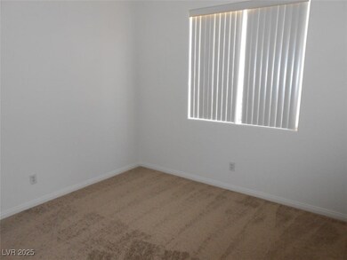 Unfurnished room featuring carpet floors and baseb