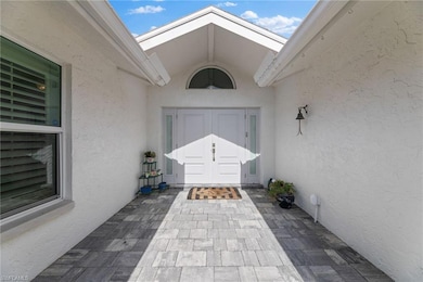 Property entrance featuring a patio