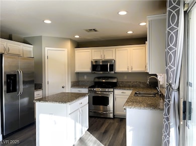 Kitchen with appliances with stainless steel finis