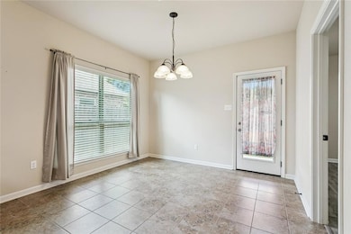 Dining / Breakfast: Tile Flooring - Wall of Windows - Rear Yard Access - Open to Kitchen & Great Room