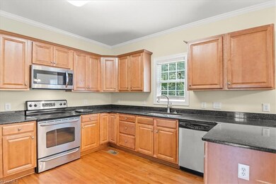Kitchen with lots of counter space & SS appliances