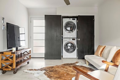 Laundry area with wood finished floors, laundry a