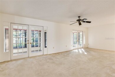 Large living room opens to sunroom