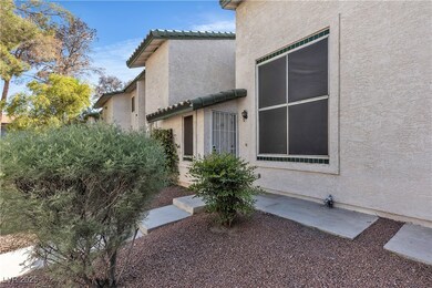 Entrance to property with stucco siding and a tile