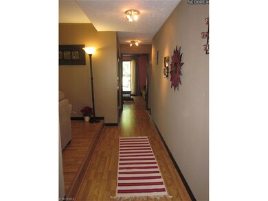 Foyer has laminate flooring.