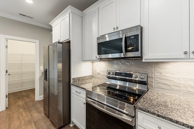 Tile backsplash & luxury finishes! Fridge included!