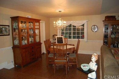 FORMAL DINING ROOM WITH CRYSTAL CHANDELIER 