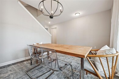 Dining room with dark hardwood / wood-style floori