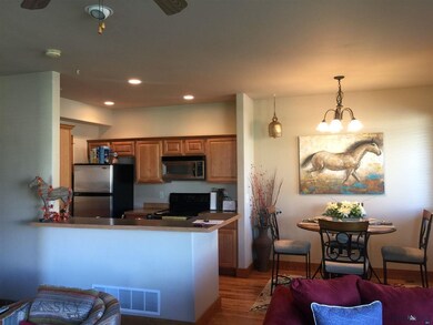 Dining area and kitchen have beautiful wood floors