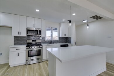 Kitchen featuring tasteful backsplash, visible ven