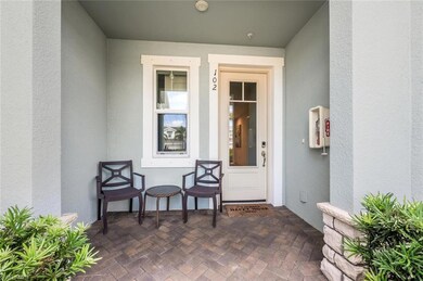 Entrance to property with stucco siding