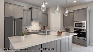 Kitchen featuring appliances with stainless steel
