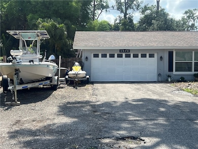 View of home's exterior with a garage, driveway, a