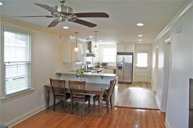 Kitchen with bar and stools  or room for a table