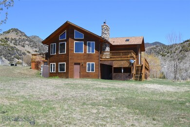 Home exterior with decks and lawn. New roof instal