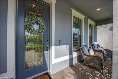 Entrance to property featuring stucco siding and a