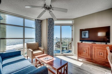 Living room with a textured ceiling, ceiling fan, 