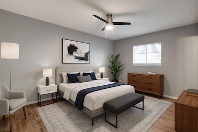 Bedroom featuring light wood-style floors and a c