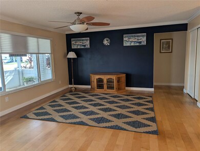 Living room view to hallway leading to both baths/bedrooms. Guest BR to left, Primary BR to right.