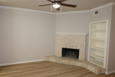 Unfurnished living room featuring wood finished f