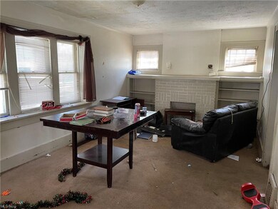 Spacious living area with fireplace and built in s