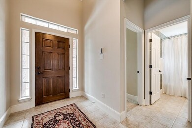 Entry way, secondary bedroom and full bath to the 